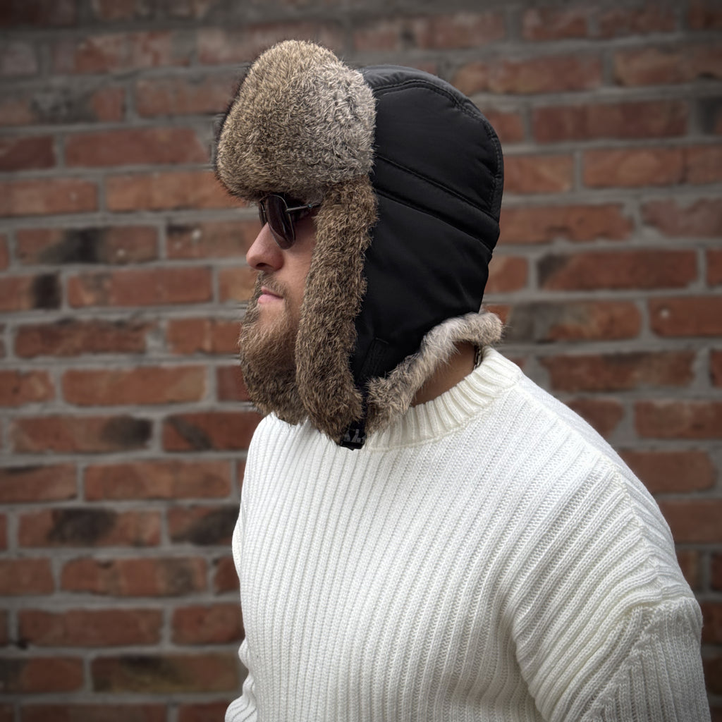 Side view of men's black ushanka hat with natural rabbit fur